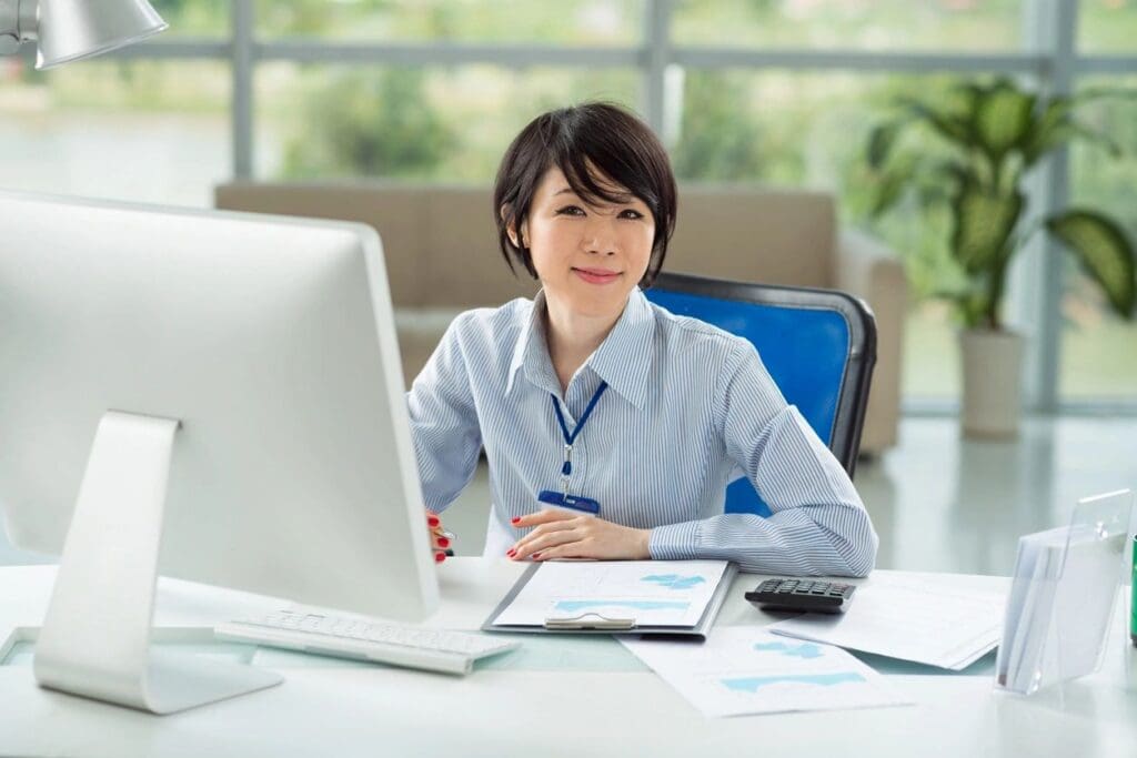 Young Asian manager working on computer
